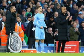 James McAtee with Manchester City manager Pep Guardiola as he prepares to make his Premier League debut for the English champions against Everton in November 2021. (Photo by Alex Livesey/Getty Images)