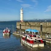 Passengers from a Norwegian Cruise Line ship tender into Newhaven Harbour, ready to spend cash in Edinburgh and environs