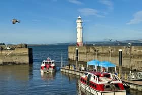 Passengers from a Norwegian Cruise Line ship tender into Newhaven Harbour, ready to spend cash in Edinburgh and environs