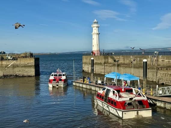 Passengers from a Norwegian Cruise Line ship tender into Newhaven Harbour, ready to spend cash in Edinburgh and environs