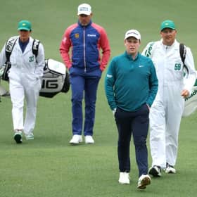 Bob MacIntyre walks ahead of Lee Westwood during the third round of The Masters at Augusta National Golf Club. Picture: Andrew Redington/Getty Images.