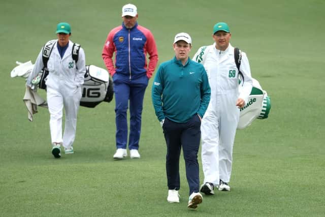 Bob MacIntyre walks ahead of Lee Westwood during the third round of The Masters at Augusta National Golf Club. Picture: Andrew Redington/Getty Images.