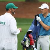 Jordan Spieth talks with his caddie Michael Greller on the practice area at Augusta National Golf Club. Picture: Patrick Smith/Getty Images.