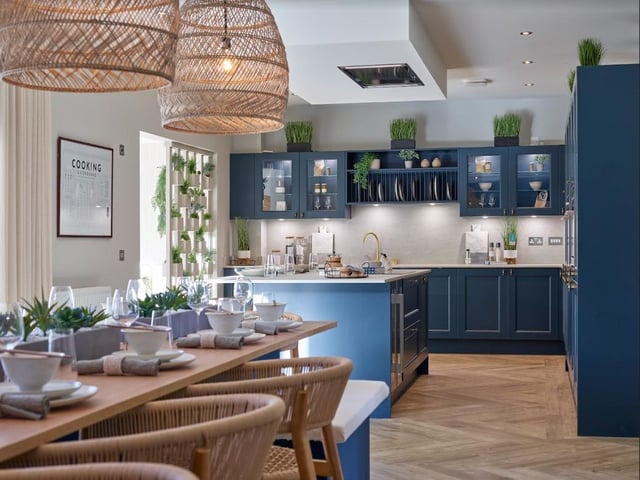 Interior: The heart of the home is formed by an open-plan kitchen, dining and family area, alongside a garden room featuring large cathedral windows. There is a lounge and the snug is currently used as a cinema.