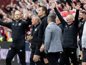 Hearts interim manager Steven Naismith, left, celebrates the 1-1 draw with Hibs.