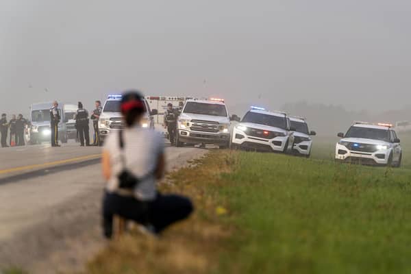 Police and investigators gather at the scene where a stabbing suspect was arrested in Rosthern, Saskatchewan on Wednesday, Sept. 7, 2022. Canadian police arrested Myles Sanderson, the second suspect in the stabbing deaths of multiple people in Saskatchewan, after a three-day manhunt that also yielded the body of his brother fellow suspect, Damien Sanderson.(Heywood Yu/The Canadian Press via AP)