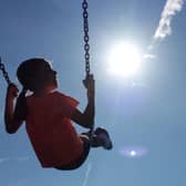 A child enjoying a swing. The full rollout of a benefit payment to low-income families in Scotland has been hailed as a "watershed moment". Picture: Peter Byrne/PA Wire