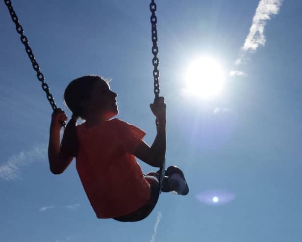A child enjoying a swing. The full rollout of a benefit payment to low-income families in Scotland has been hailed as a "watershed moment". Picture: Peter Byrne/PA Wire