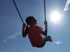 A child enjoying a swing. The full rollout of a benefit payment to low-income families in Scotland has been hailed as a "watershed moment". Picture: Peter Byrne/PA Wire