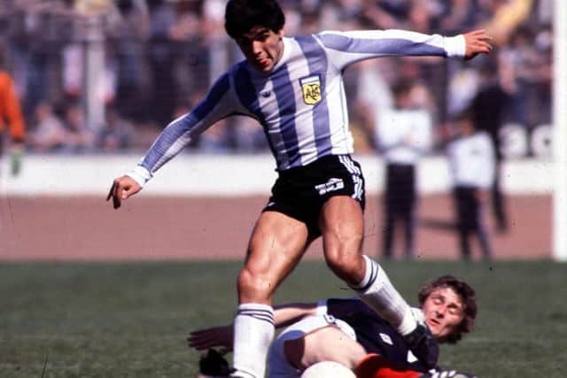 Diego Maradona skips past a challenge from Paul Hegarty during Argentina's 1979 win over Scotland at Hampden.