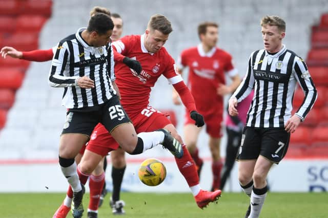 Aberdeen's Florian Kamberi (centre) is challenged by Ethan Erhahon (L) and Jak Doyle-Hayes of St Mirren during Saturday's 0-0 draw with St Mirren (Photo by Ross MacDonald / SNS Group)