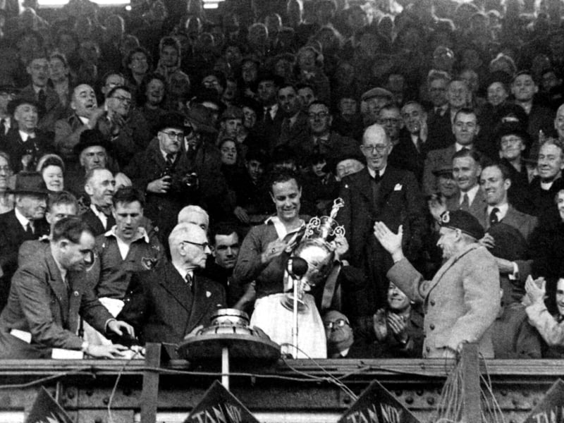 Pompey captain Reg Flewin with the championship trophy at Fratton Park at the end of the 1948-49 season, alongside club president Field Marshal Montgomery