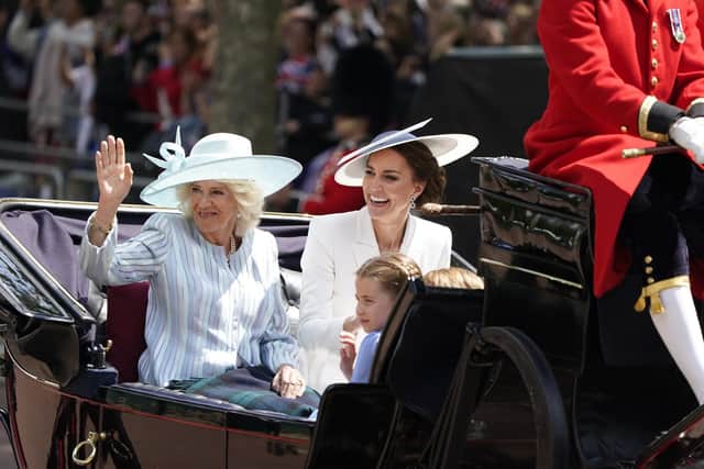 The Duchess of Cornwall, the Duchess of Cambridge and Princess Charlotte ride in a carriage as the Royal Procession returns to Buckingham Palace following the Trooping the Colour
