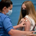 Teenager Eve Thomson receives a Covid vaccination last year. Picture: Jeff J Mitchell/Getty Images