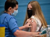 Teenager Eve Thomson receives a Covid vaccination last year. Picture: Jeff J Mitchell/Getty Images