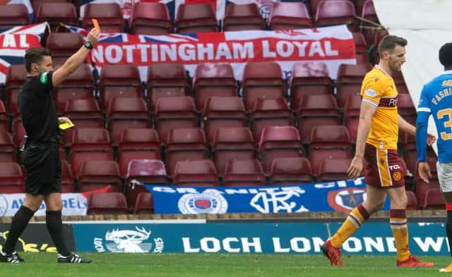Motherwell captain Stephen O'Donnell is sent off by referee Nick Walsh for a second bookable offence against Rangers at Fir Park. (Photo by Craig Foy / SNS Group)