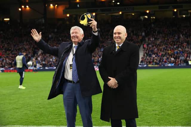 Sir Alex Ferguson is presented with a Scotland Cap by Mike Mulraney during a FIFA World Cup Qualifier between Scotland and Israel at Hampden Park, on October 09 , 2021, in Glasgow, Scotland. (Photo by Alan Harvey / SNS Group)