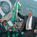 Ange Postecoglou lifts the Scottish Cup outside Celtic Park as fans congregate to celebrate the treble. (Photo by Ewan Bootman / SNS Group)