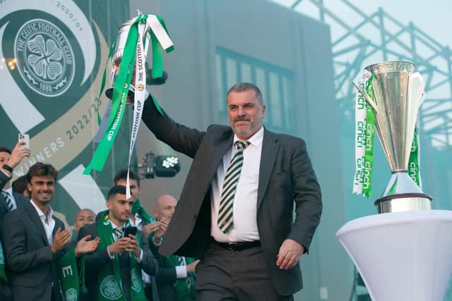 Ange Postecoglou lifts the Scottish Cup outside Celtic Park as fans congregate to celebrate the treble. (Photo by Ewan Bootman / SNS Group)