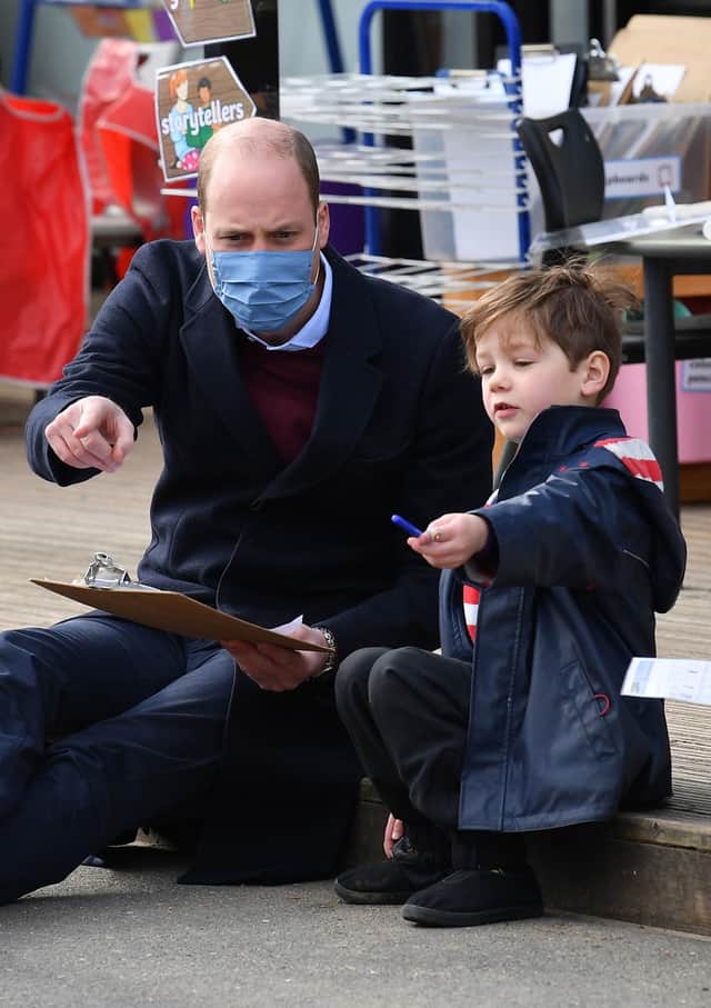 The Duke of Cambridge plays with a child in the playground during a visit to School 21 in Stratford, east London. (Photo: Justin Tallis/PA Wire)