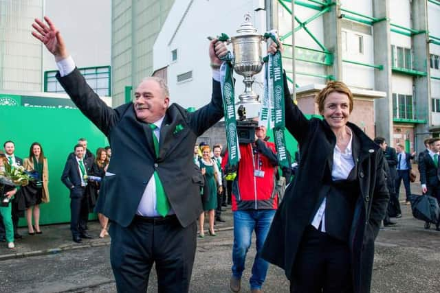 Career highlight: Hibernian Chairman Rod Petrie (left) hoists the Scottish Cup with Chief Executive Leeann Dempster