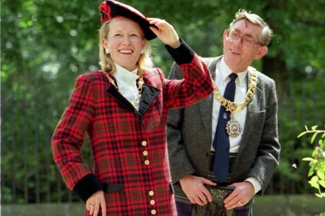 Norman Irons - in trademark kilt - admires wife Anne in the red tartan outfit designed by Betty Davies for the Lord Mayor's Show in July 1992 (Picture: Denis Straughan)