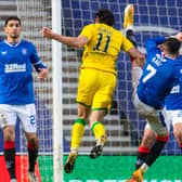 Rangers' Ianis Hagi (R) challenges Hibs' Joe Newell in the box during the Boxing Day clash at Ibrox but the midfielder was denied a penalty. Photo by Rob Casey/SNS Group