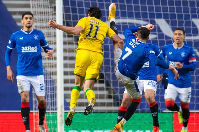 Rangers' Ianis Hagi (R) challenges Hibs' Joe Newell in the box during the Boxing Day clash at Ibrox but the midfielder was denied a penalty. Photo by Rob Casey/SNS Group