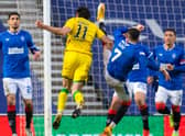 Rangers' Ianis Hagi (R) challenges Hibs' Joe Newell in the box during the Boxing Day clash at Ibrox but the midfielder was denied a penalty. Photo by Rob Casey/SNS Group