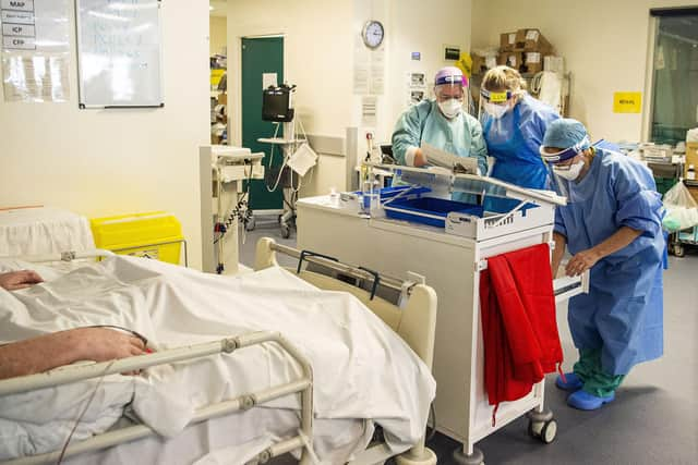 Staff attending to a patient in the ICU. Picture: Lisa Ferguson