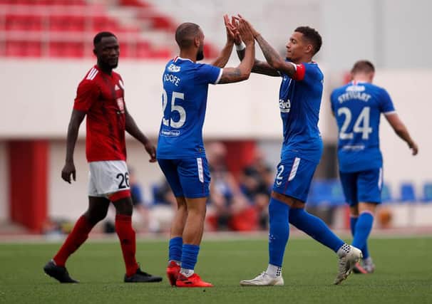 GIBRALTAR, GIBRALTAR - SEPTEMBER 17: James Tavernier of Rangers celebrates with teammates after scoring his team's first goal from a free-kick during the UEFA Europa League second qualifying round match between Lincoln Red Imps and Rangers at Victoria Stadium on September 17, 2020 in Gibraltar, Gibraltar. (Photo by Fran Santiago/Getty Images)