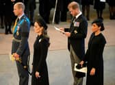 Prince Harry and Meghan, Duchess of Sussex, seen with the Prince and Princess of Wales during Queen Elizabeth's Lying-in State (Picture: Christopher Furlong/Getty Images)