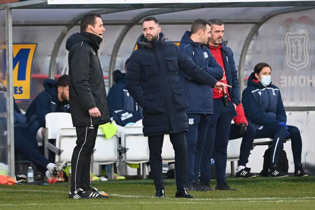 Dundee manager James McPake speaks to the fourth official during the 1-0 defeat by Hearts.