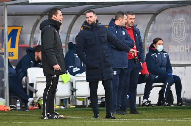 Dundee manager James McPake speaks to the fourth official during the 1-0 defeat by Hearts.