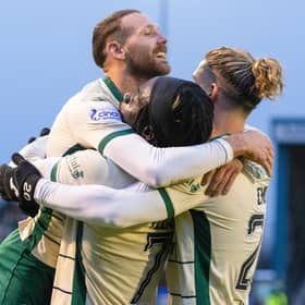 Martin Boyle, Elie Youan and Emiliano Marcondes celebrate Hibs' win over Inverness.