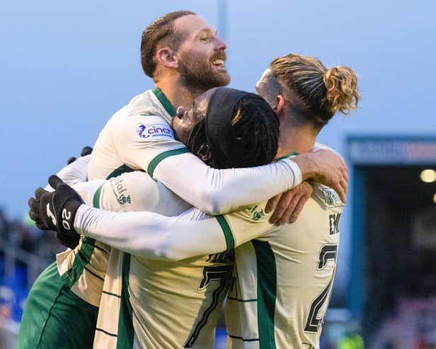 Martin Boyle, Elie Youan and Emiliano Marcondes celebrate Hibs' win over Inverness.