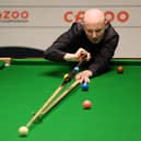 Anthony McGill of Scotland plays a shot during their round two match against Jack Lisowski of England on Day Nine of the Cazoo World Snooker Championship 2023 at the Crucible Theatre in Sheffield.