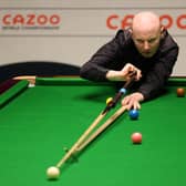 Anthony McGill of Scotland plays a shot during their round two match against Jack Lisowski of England on Day Nine of the Cazoo World Snooker Championship 2023 at the Crucible Theatre in Sheffield.