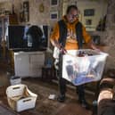 Kinloss Park resident Andrew McIntosh looks through his damaged belongings. Picture: Lisa Ferguson





Parts of CupaR  were hit badly, the River Eden burst its banks and Kinloss Park residents houses were flooded by the Ladyburn over flowing also