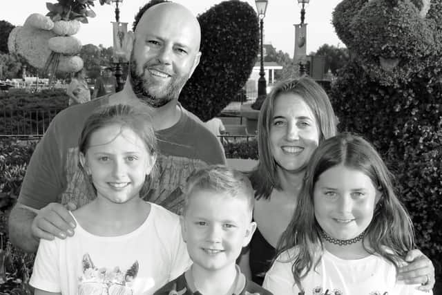 Andrew with Lousie and their children.