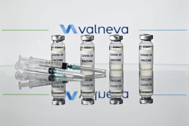 An illustration picture shows vials with Covid-19 Vaccine stickers attached and syringes with the logo of French-Austrian vaccine firm Valneva. Picture: Justin Tallis/AFP via Getty Images