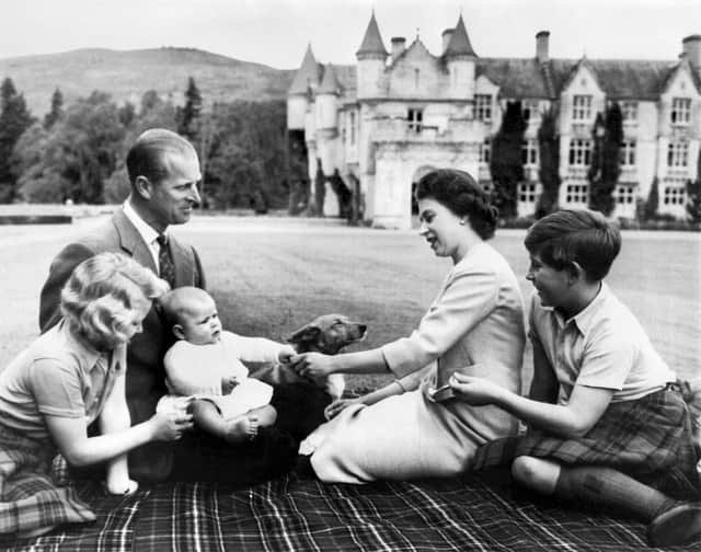 At home at Balmoral. The Duke of Edinburgh is pictured with The Queen and children in September 1960.