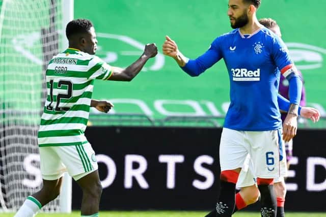 Rangers' Connor Goldson (R) and Celtic's Ismaila Soro at full time during the Scottish Premiership match between Celtic and Rangers at Celtic Park, on March 21, 2021 (Photo by Rob Casey / SNS Group)