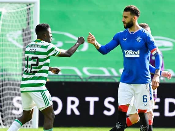 Rangers' Connor Goldson (R) and Celtic's Ismaila Soro at full time during the Scottish Premiership match between Celtic and Rangers at Celtic Park, on March 21, 2021 (Photo by Rob Casey / SNS Group)