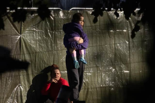Families are seen at Manston airfield migrant processing centre earlier this month. Picture: Getty Images
