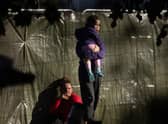 Families are seen at Manston airfield migrant processing centre earlier this month. Picture: Getty Images