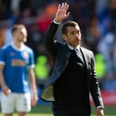 Rangers manager Giovanni van Bronckhorst acknowledges the travelling support at Fir Park after his team's 3-1 win over Motherwell.  (Photo by Craig Foy / SNS Group)