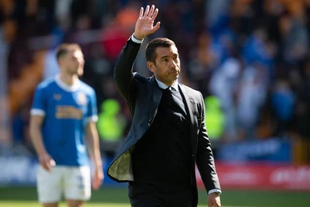 Rangers manager Giovanni van Bronckhorst acknowledges the travelling support at Fir Park after his team's 3-1 win over Motherwell.  (Photo by Craig Foy / SNS Group)