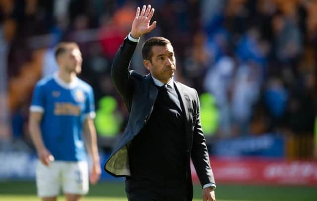 Rangers manager Giovanni van Bronckhorst acknowledges the travelling support at Fir Park after his team's 3-1 win over Motherwell. (Photo by Craig Foy / SNS Group)