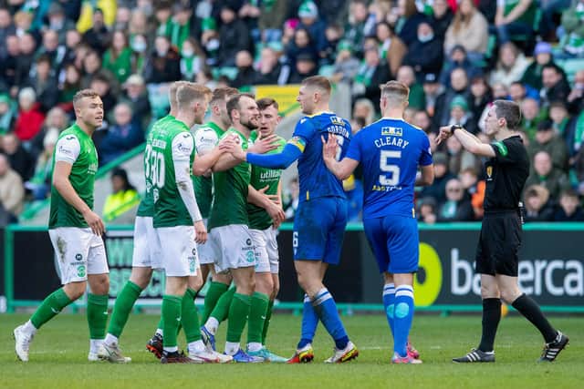 Players from both teams come together during a Cinch Premiership match between Hibernian and St. Johnstone at Easter Road. (Photo by Ross Parker / SNS Group)